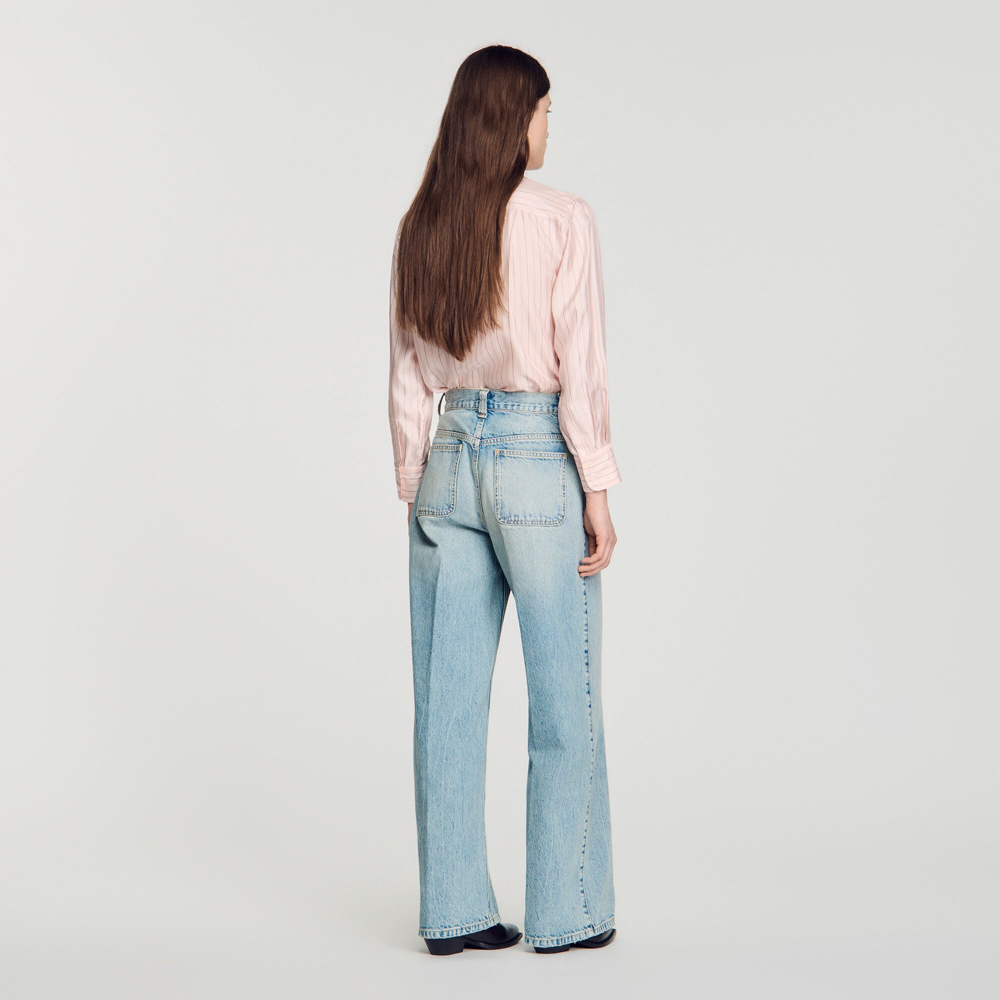 Gerade Jeans mit Lederdetails