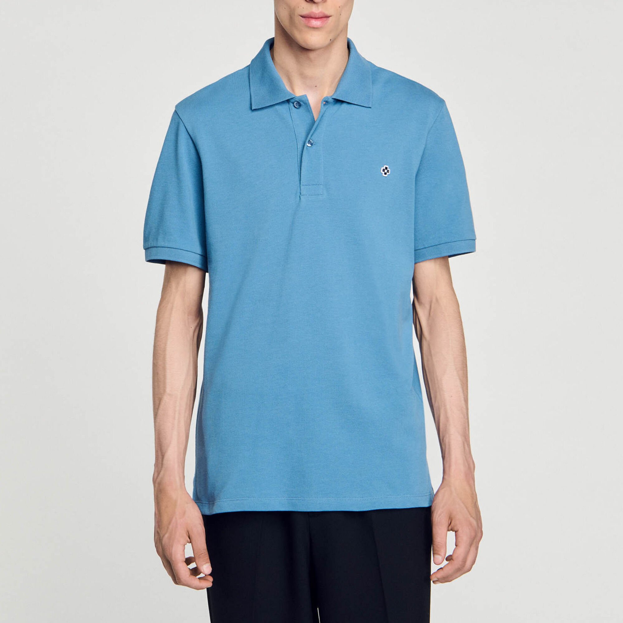 Polo mit Square-Cross-Aufnäher