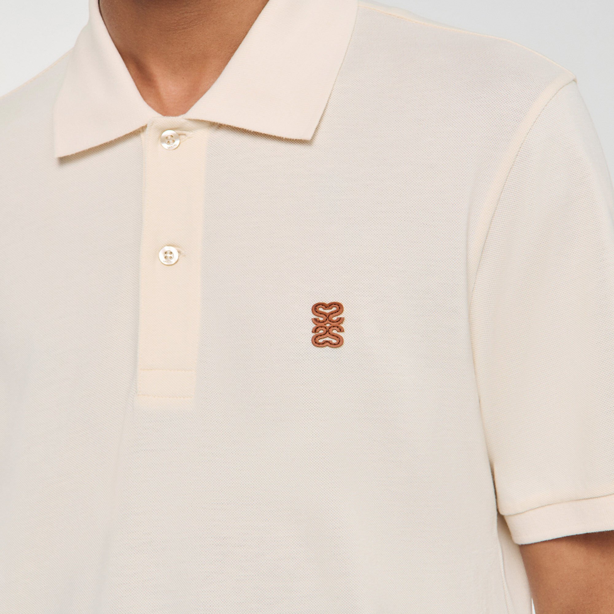 Poloshirt mit Leder-Logo