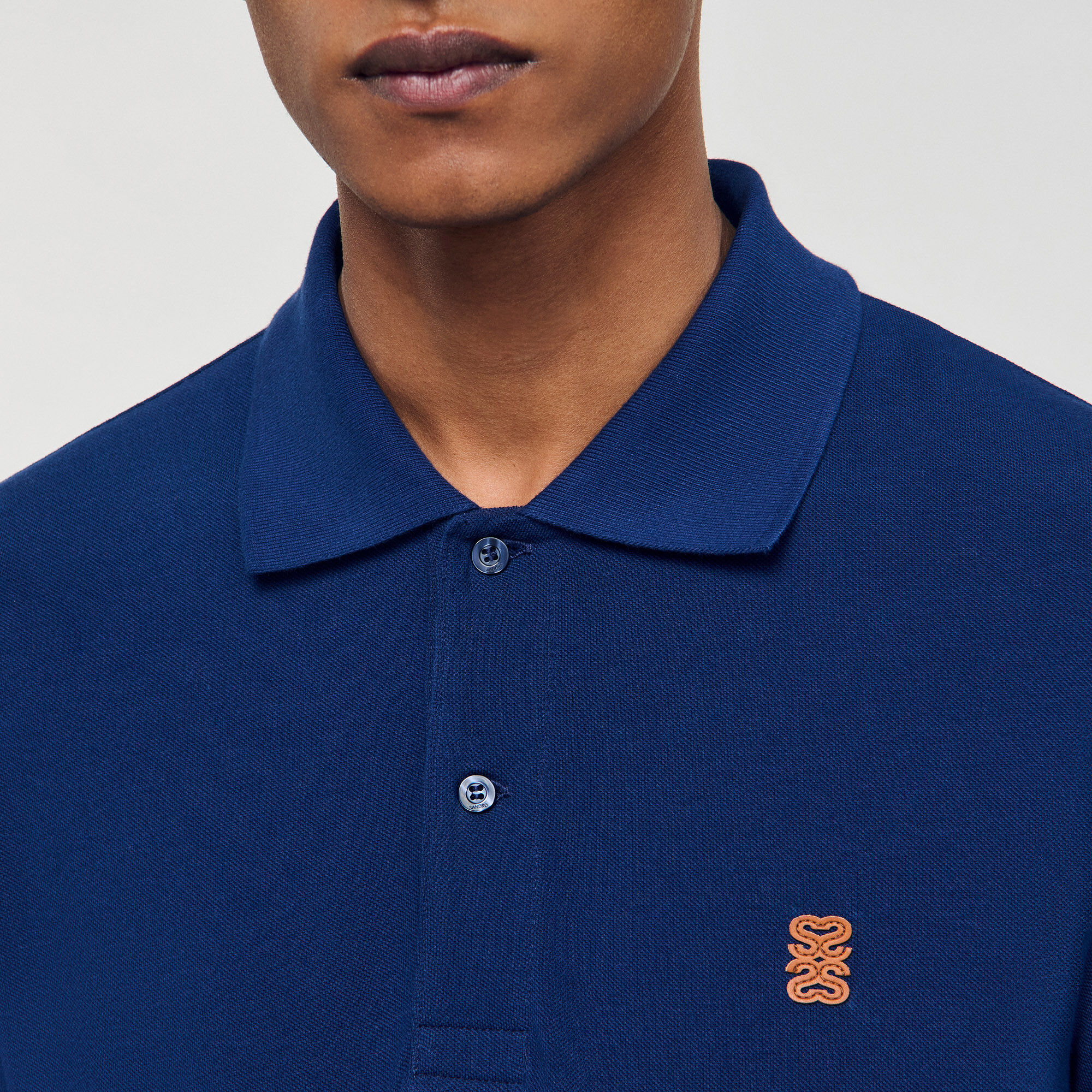 Poloshirt mit Leder-Logo