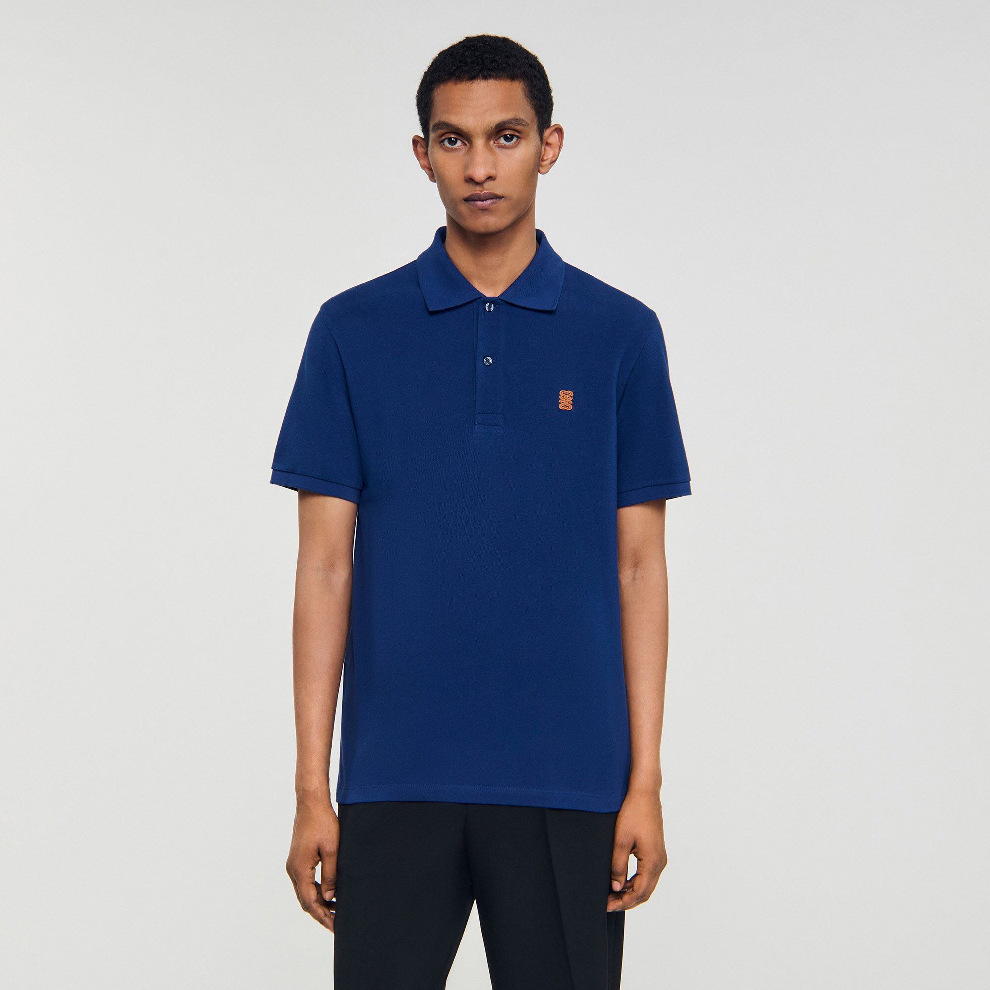 Poloshirt mit Leder-Logo