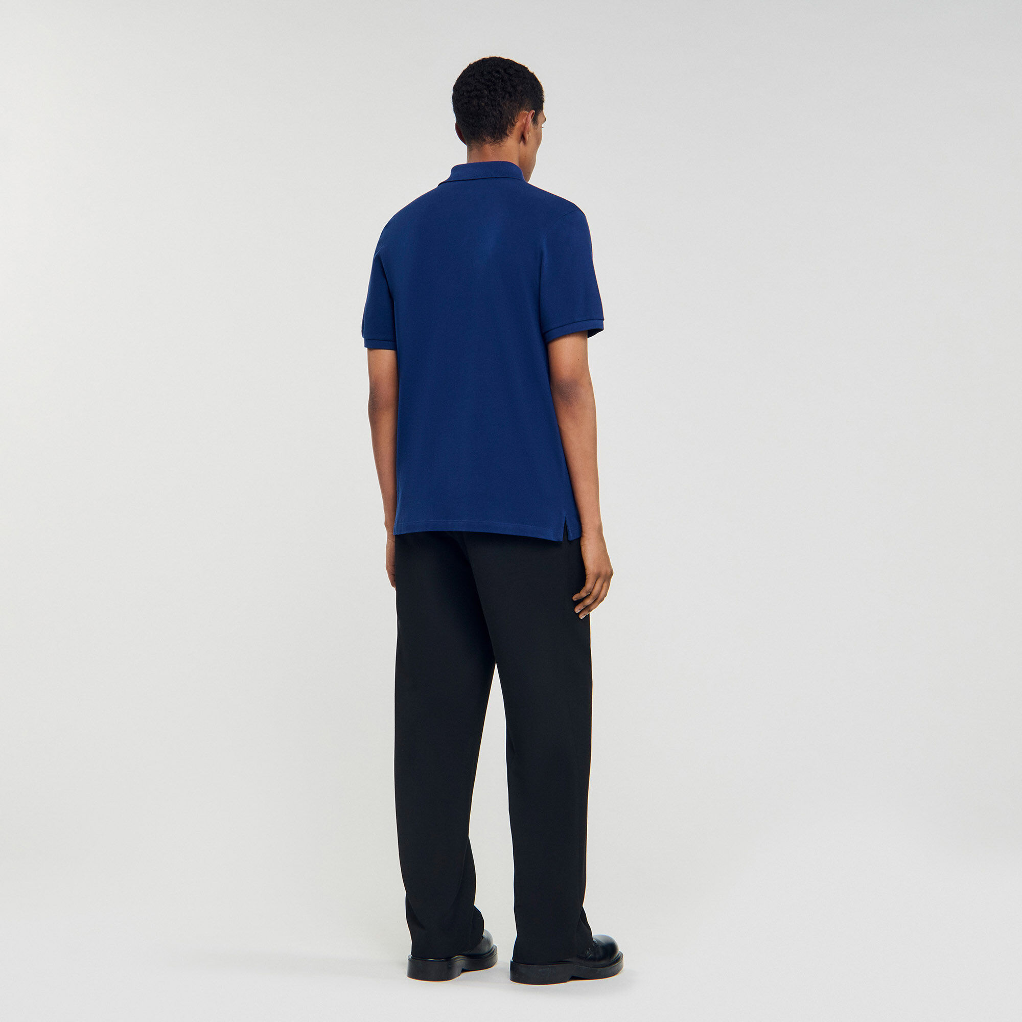 Poloshirt mit Leder-Logo