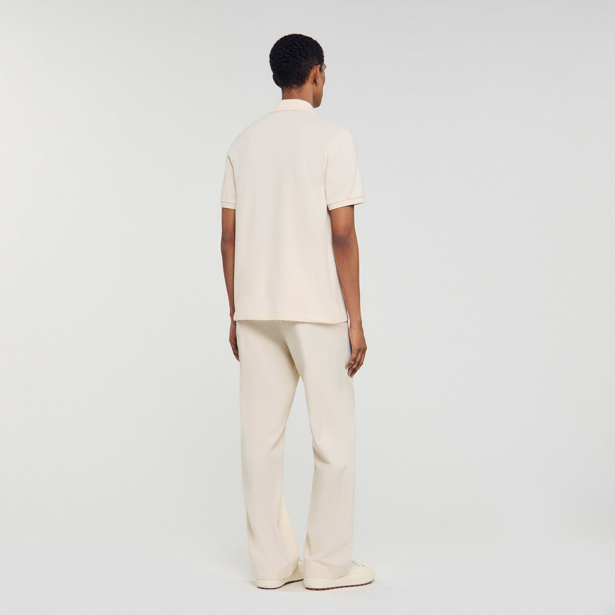 Poloshirt mit Leder-Logo