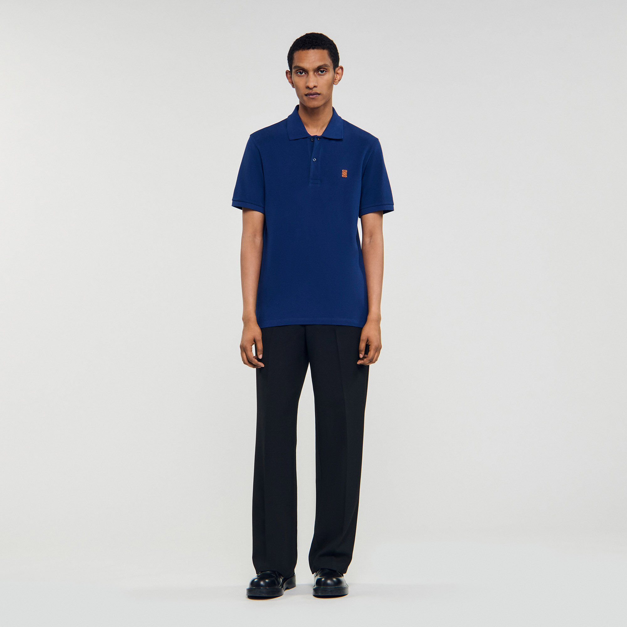 Poloshirt mit Leder-Logo
