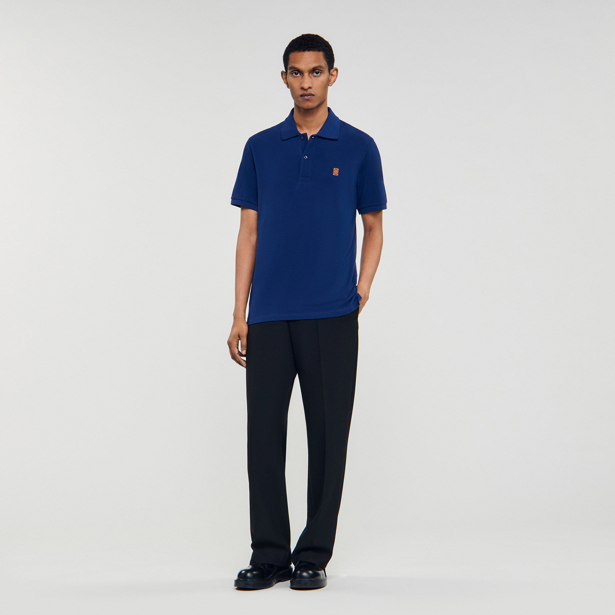 Poloshirt mit Leder-Logo