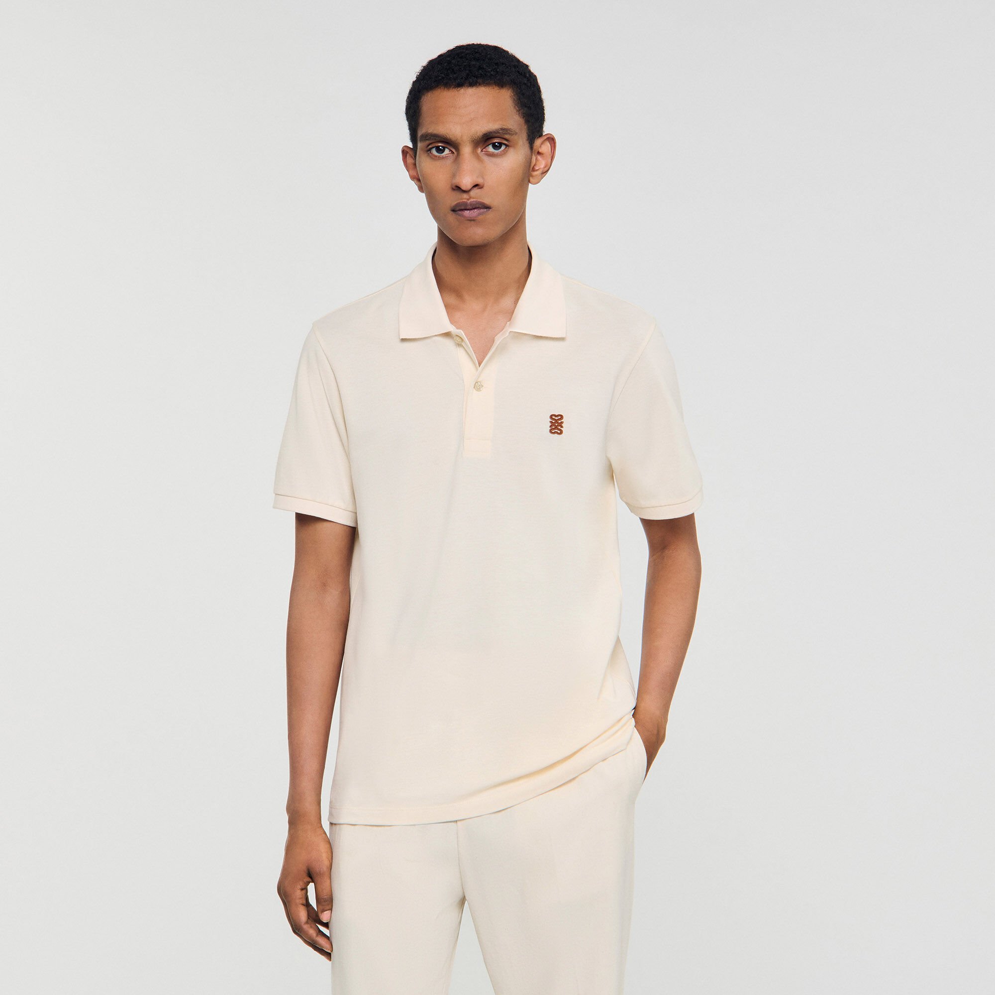 Poloshirt mit Leder-Logo